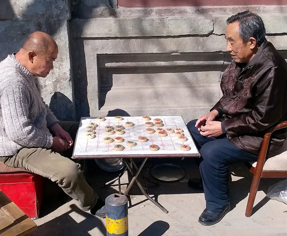 Hráči na ulici Pekingu.