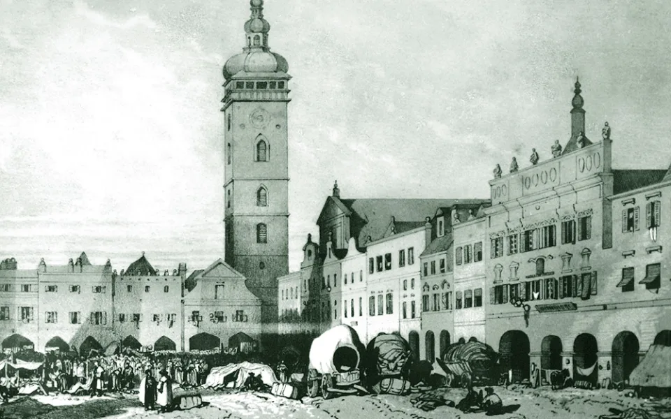 Na obrázku severovýchodního koutu náměstí z poloviny 19. století je asi hlavně zachycen trh, ale současně dobře Černá věž a hotel U Tří kohoutů vpravo.